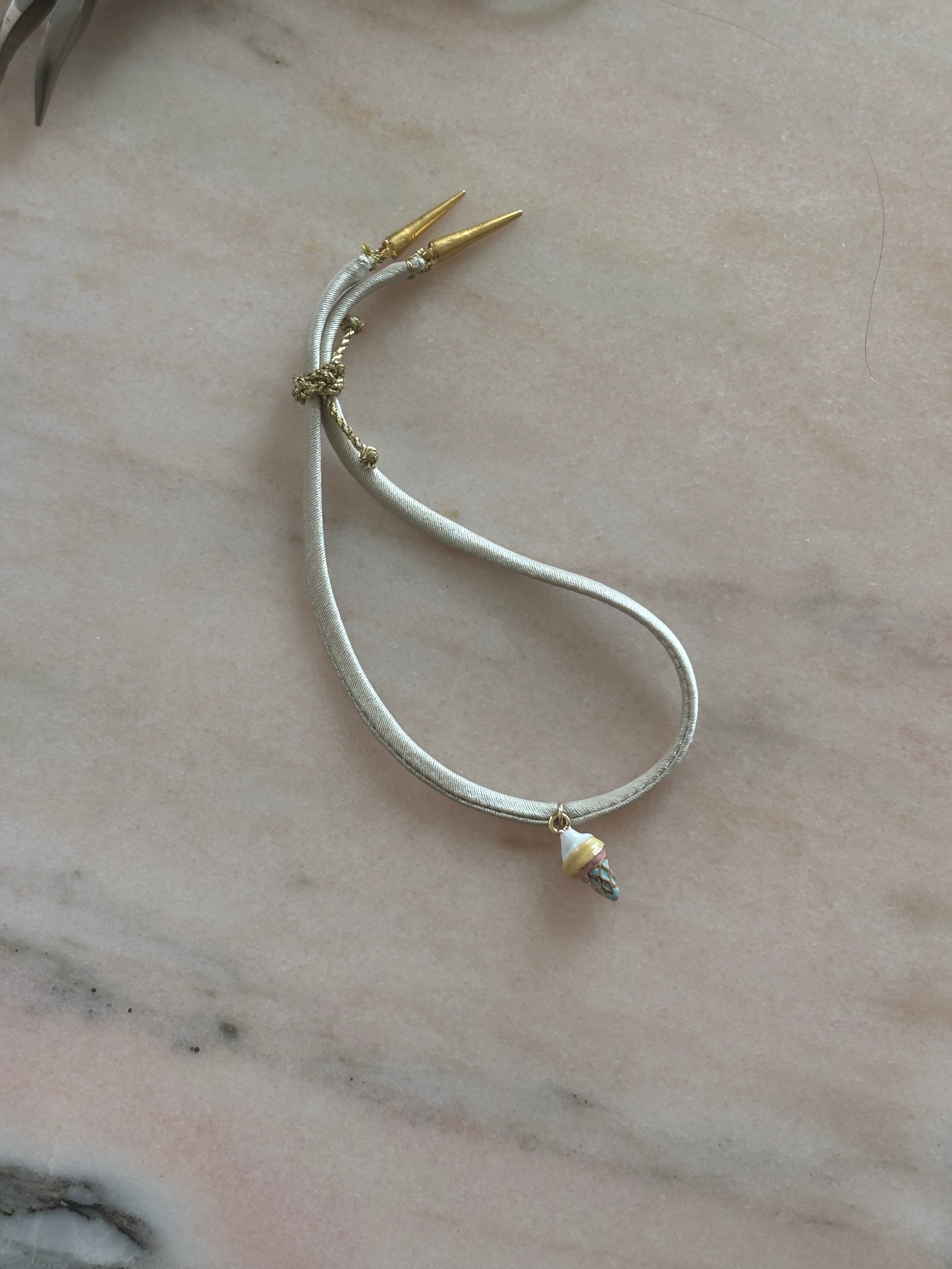 Ivory silk bracelet with ice cream cone charm by Boussidan