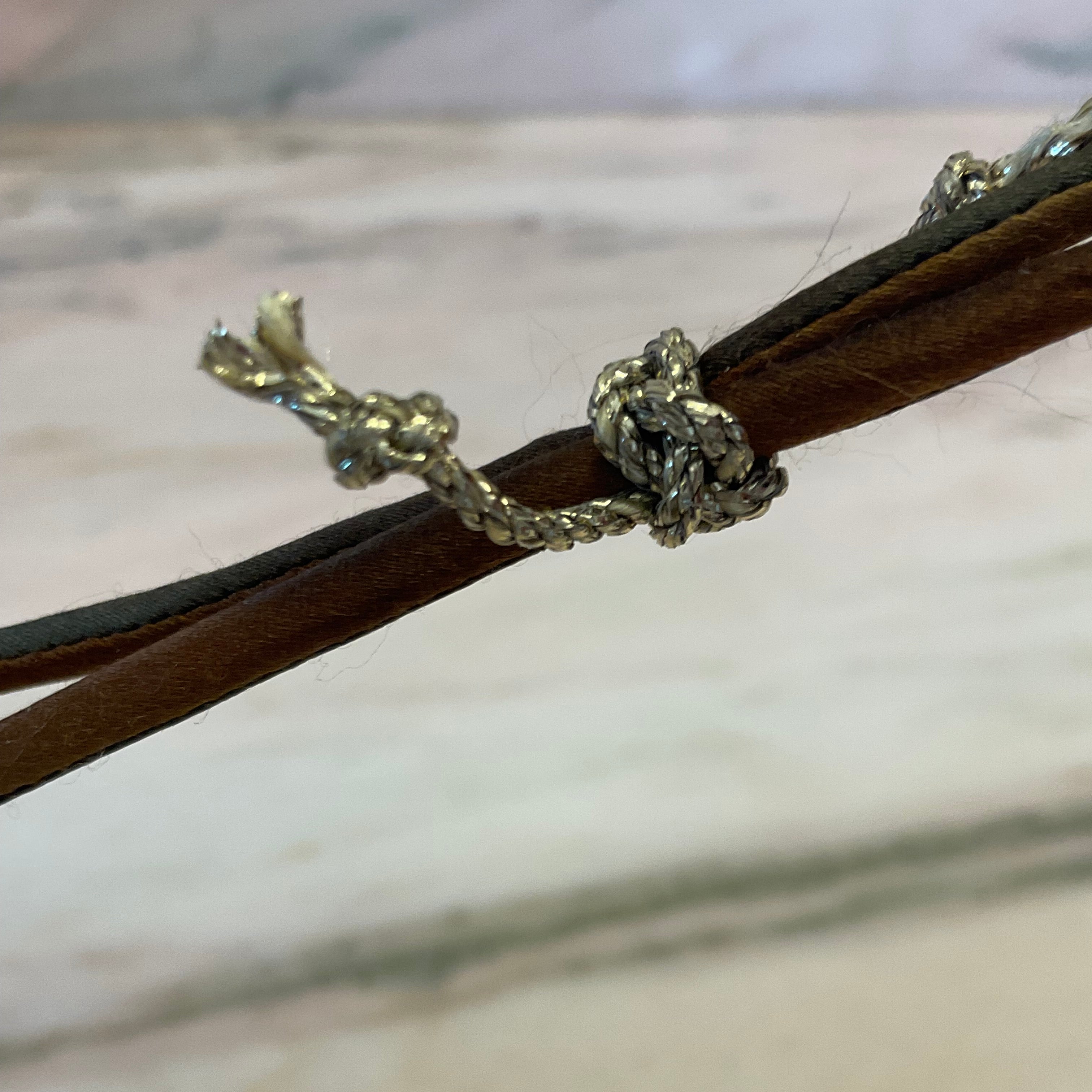 Luxurious ombre silk bracelet finished with black spinel beads on silver silk thread. Slide the gold cord hand button up and down to adjust to your wrist by boussidan