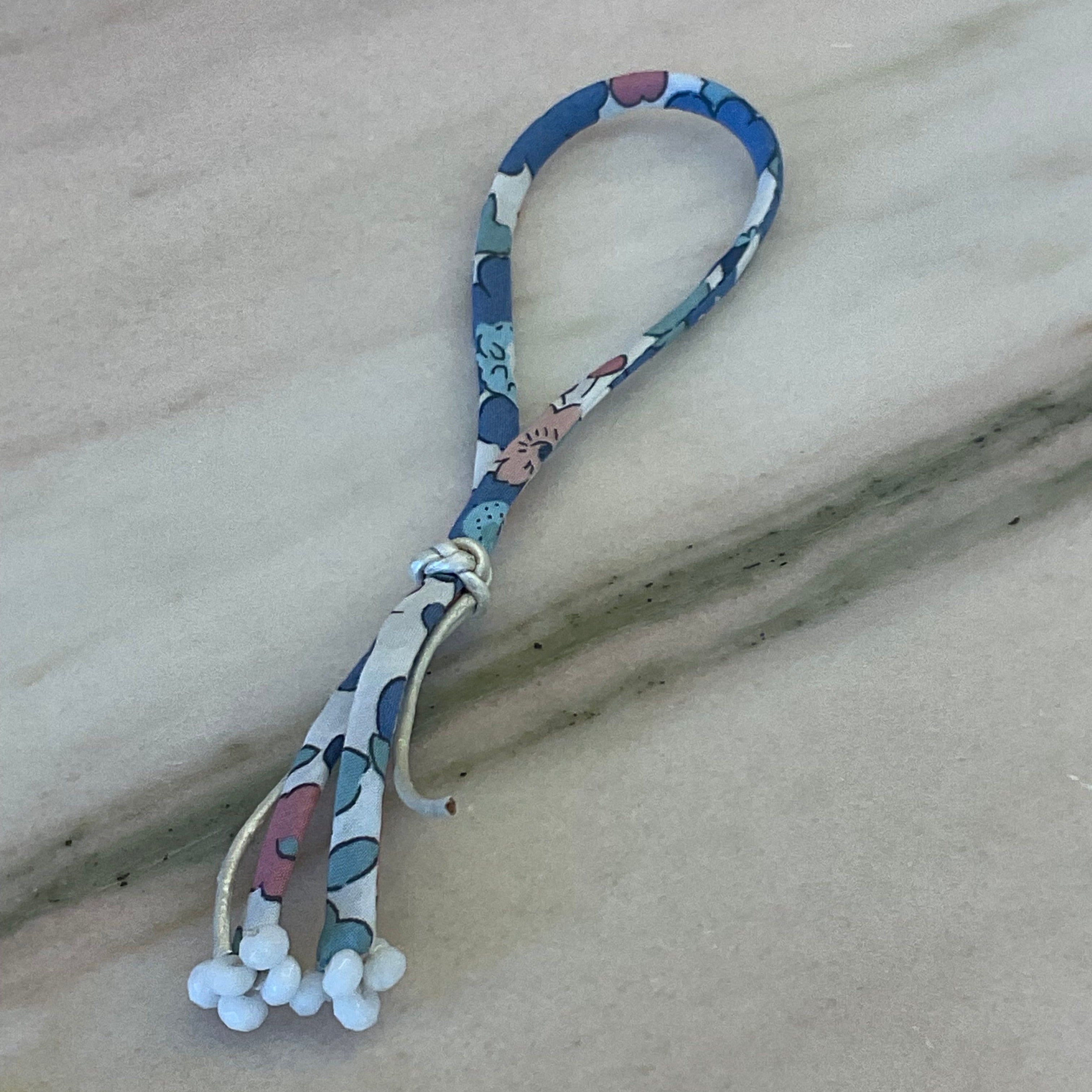 Lifestyle shot of Fearie Wild-Flowers Liberty Bracelet in a whimsical setting, handcrafted by Boussidan