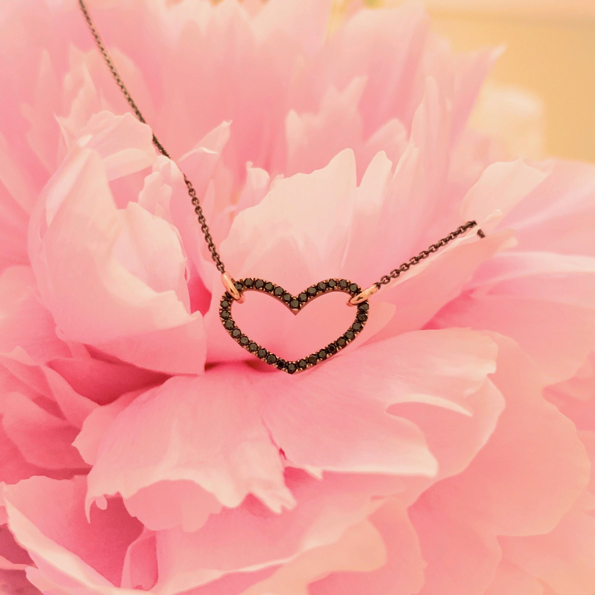 14k rose gold midnight heart necklace side on flower by boussidan