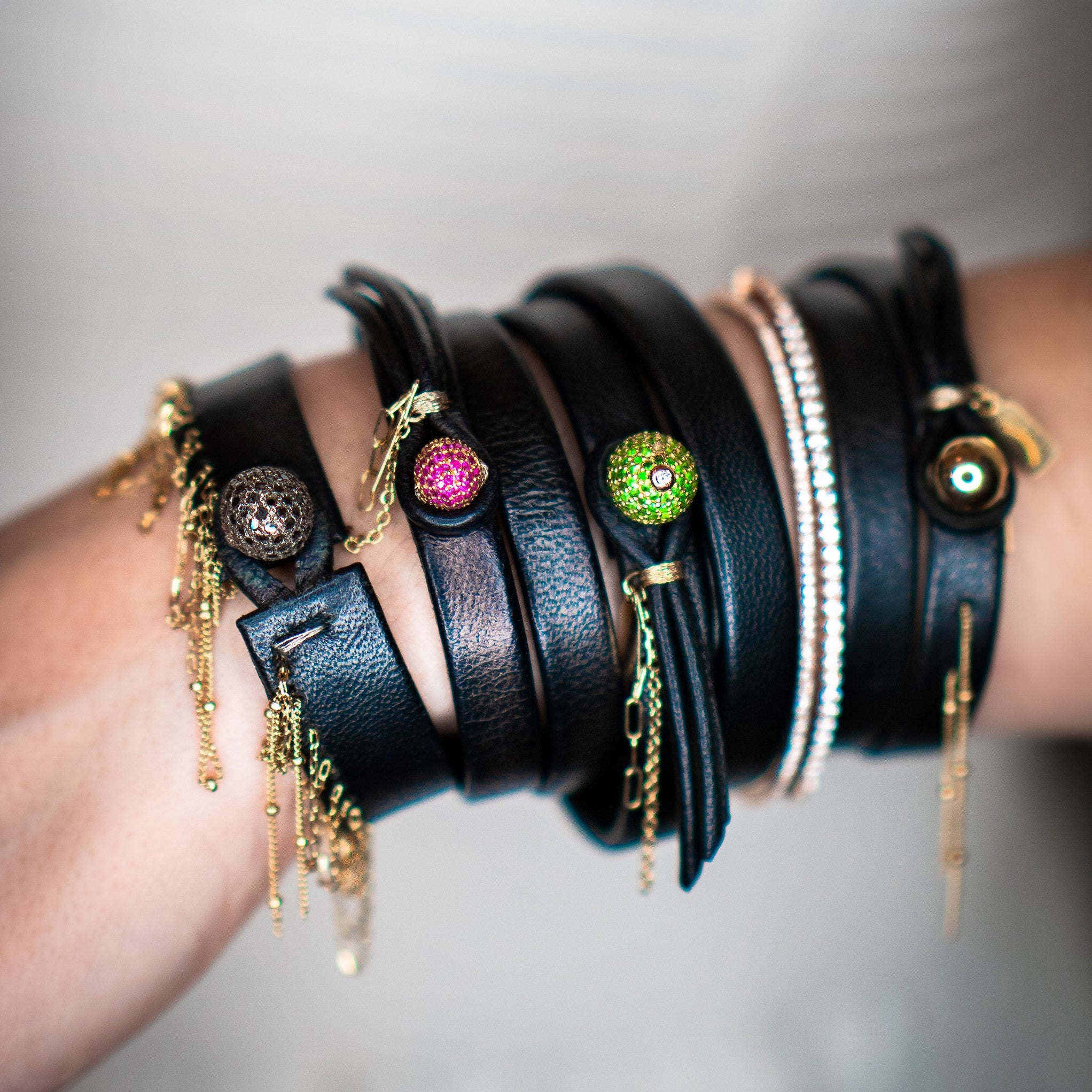 The Aurum 14k gold leather bracelet worn on wrist