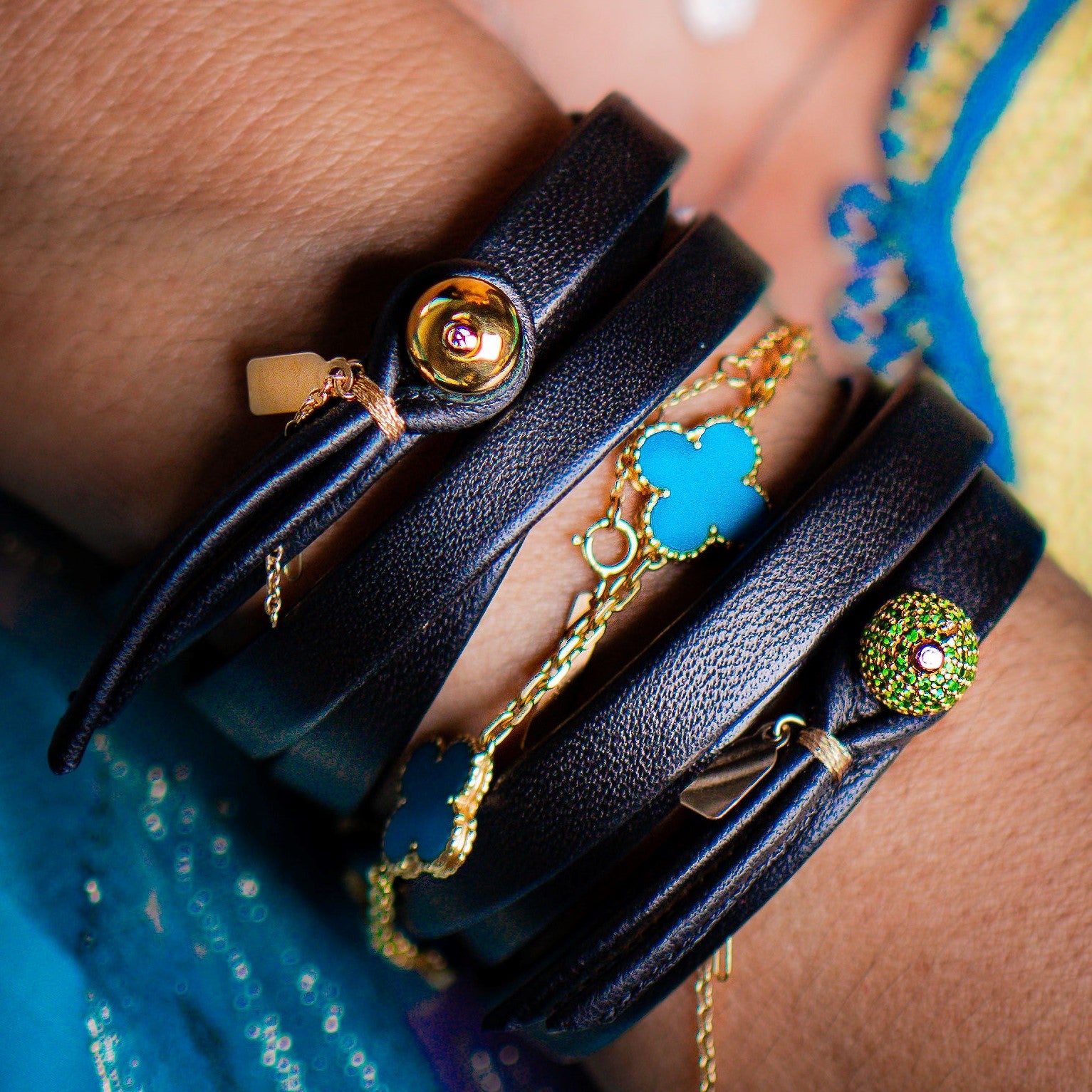 The Diamant 14k gold and diamond triple wrap leather bracelet worn on wrist