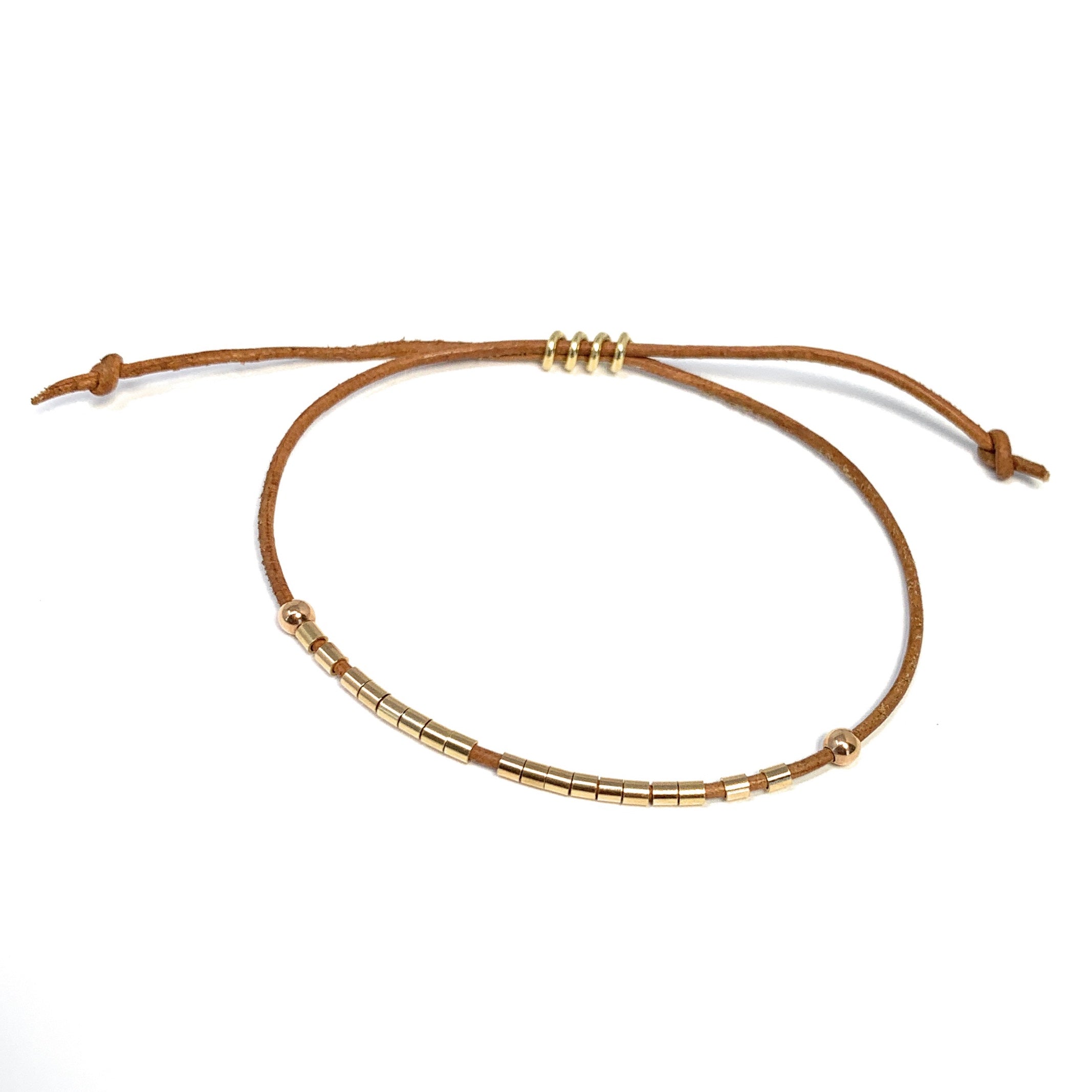 14k gold tubes on leather bracelet by Boussidan