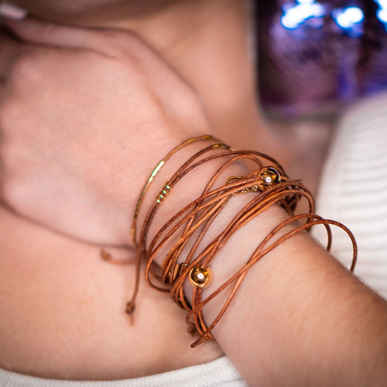 14k gold tubes on leather bracelet on model by Boussidan