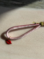 Load image into Gallery viewer, Red lips enamel charm pink silk bracelet adjustable gold cord button red spinel gold thread 
