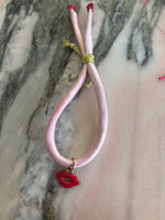 Load image into Gallery viewer, Silk bracelet pink gold thread enamel red lips charm red spinel beads
