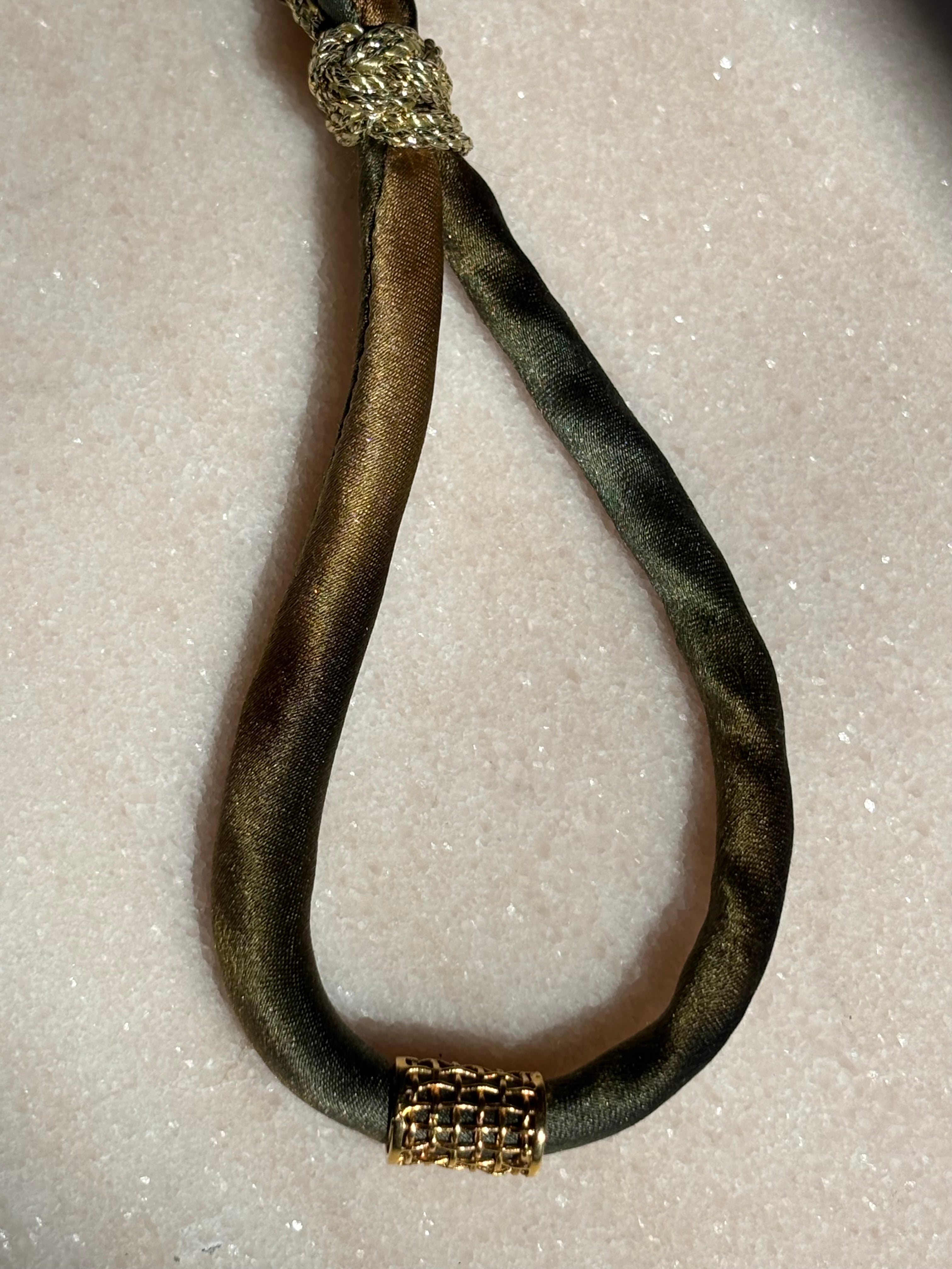 Army Gold Ombre Silk Kiss Bracelet with army green silk cord and gold-plated cage accent by Boussidan