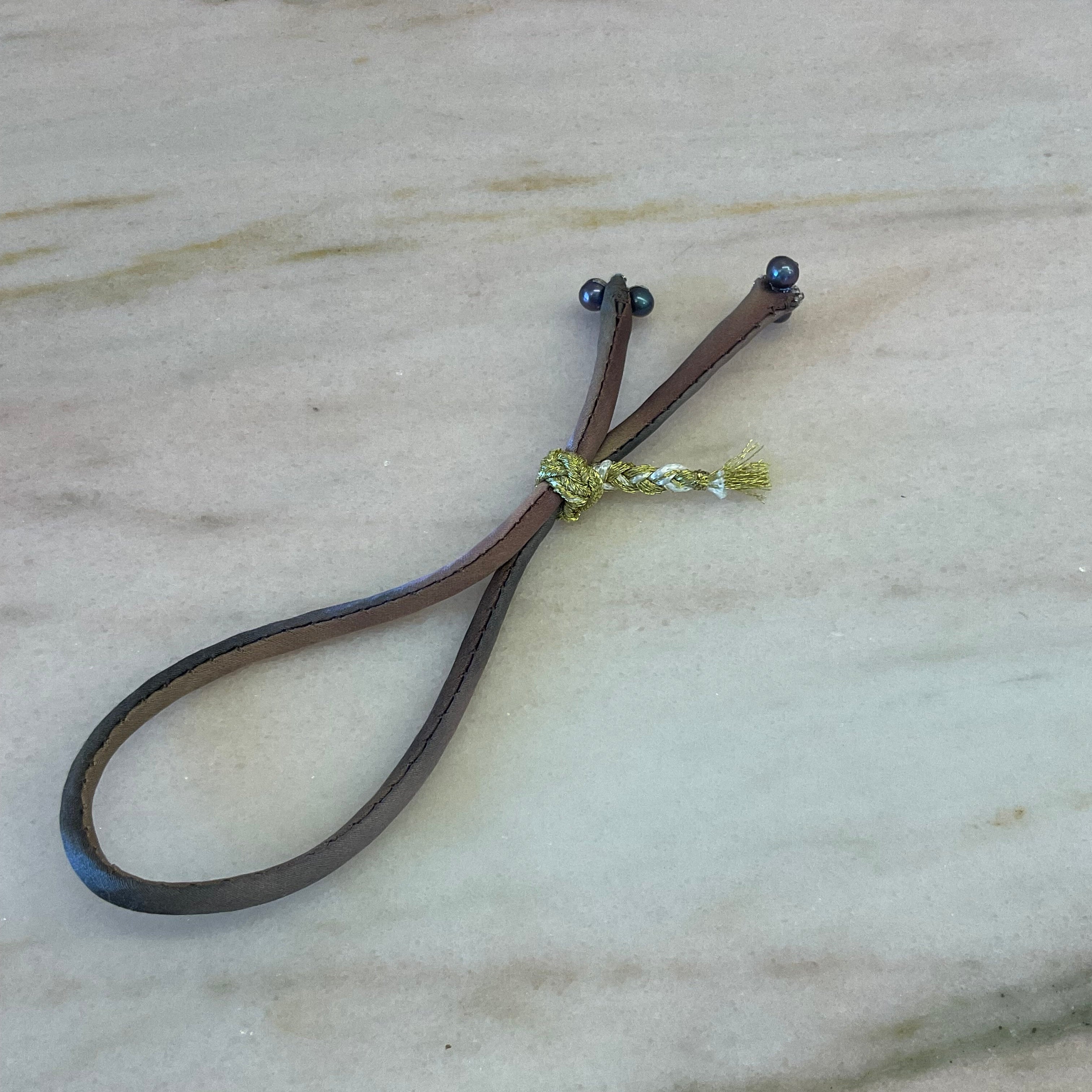 Handmade ombre silk bracelet with black pearls and gold braided button on silver thread