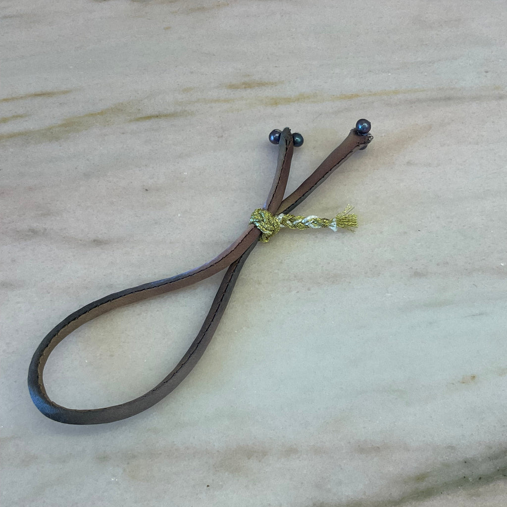 Handmade ombre silk bracelet with black pearls and gold braided button on silver thread
