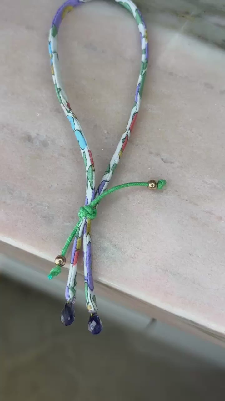 Video of Green Envy Wild-Flowers Liberty Bracelet showing floral cord, amethyst drops, and adjustable green button by Boussidan.