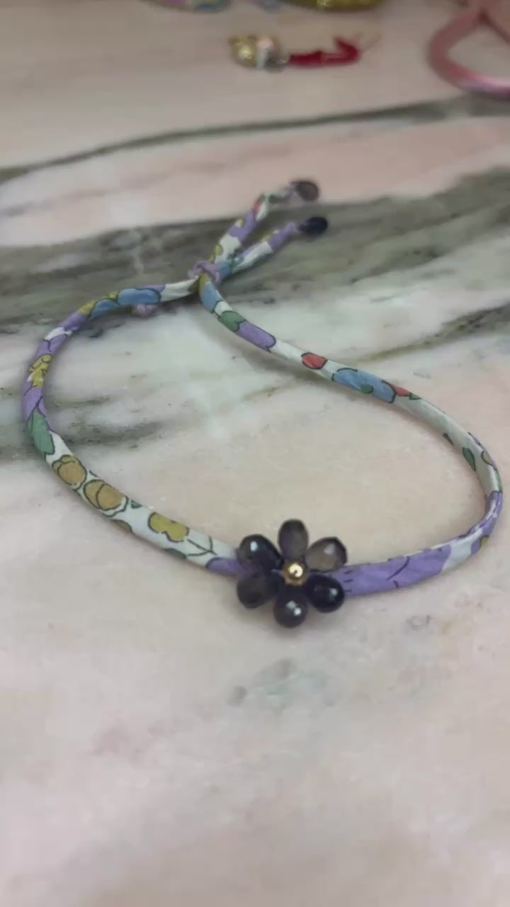 Floral patterned fabric cord  handmade amethyst flower gold filled center amethyst drops and a lavender sliding button adjustable to your wrist