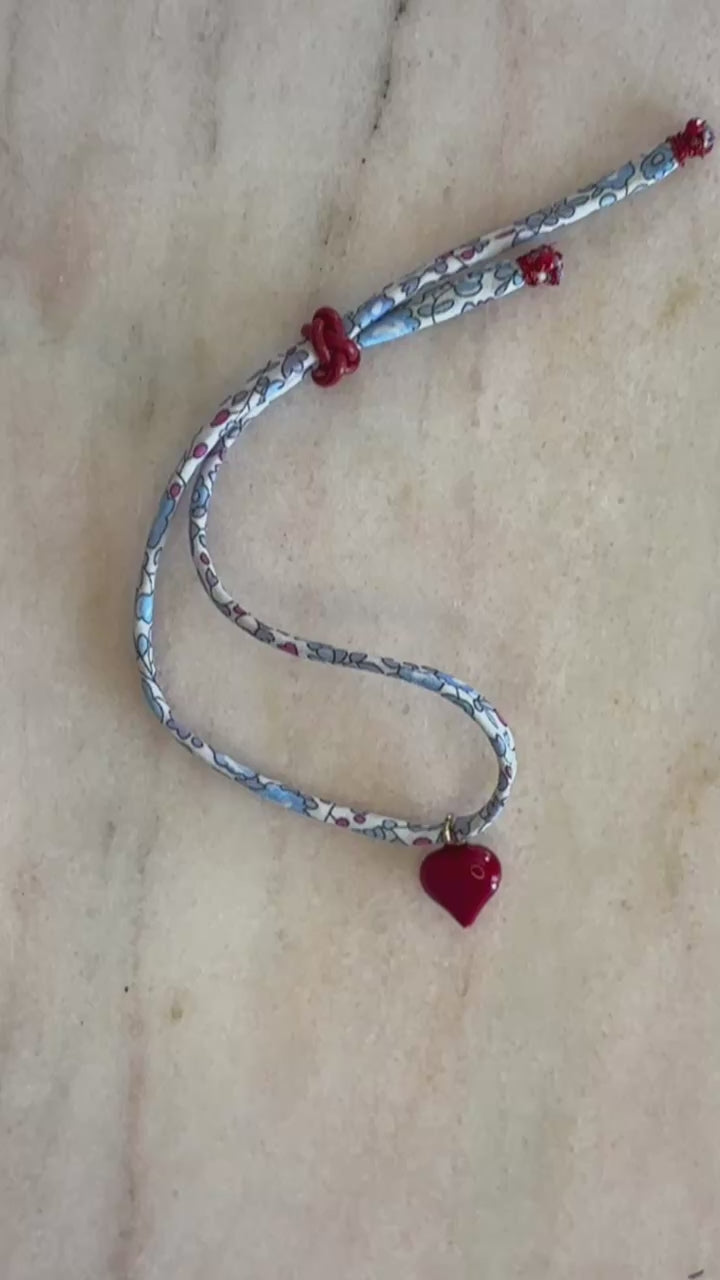 Video of Love USA Wild-Flowers Liberty Bracelet showing red-white-blue floral cord, 3D enamel heart, and adjustable leather button by Boussidan.