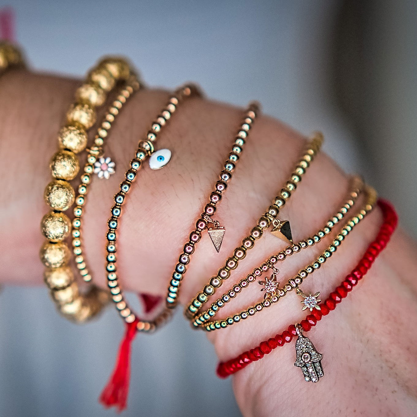 14k gold bead charms bracelet on model  by boussidan