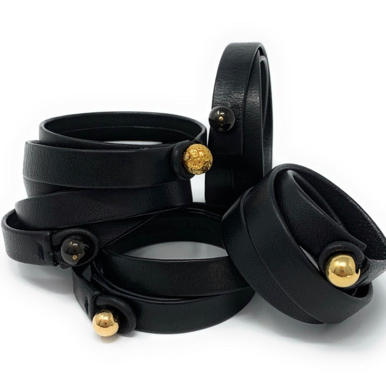 The Oro unisex leather bracelet styled with bold evening look by Boussidan