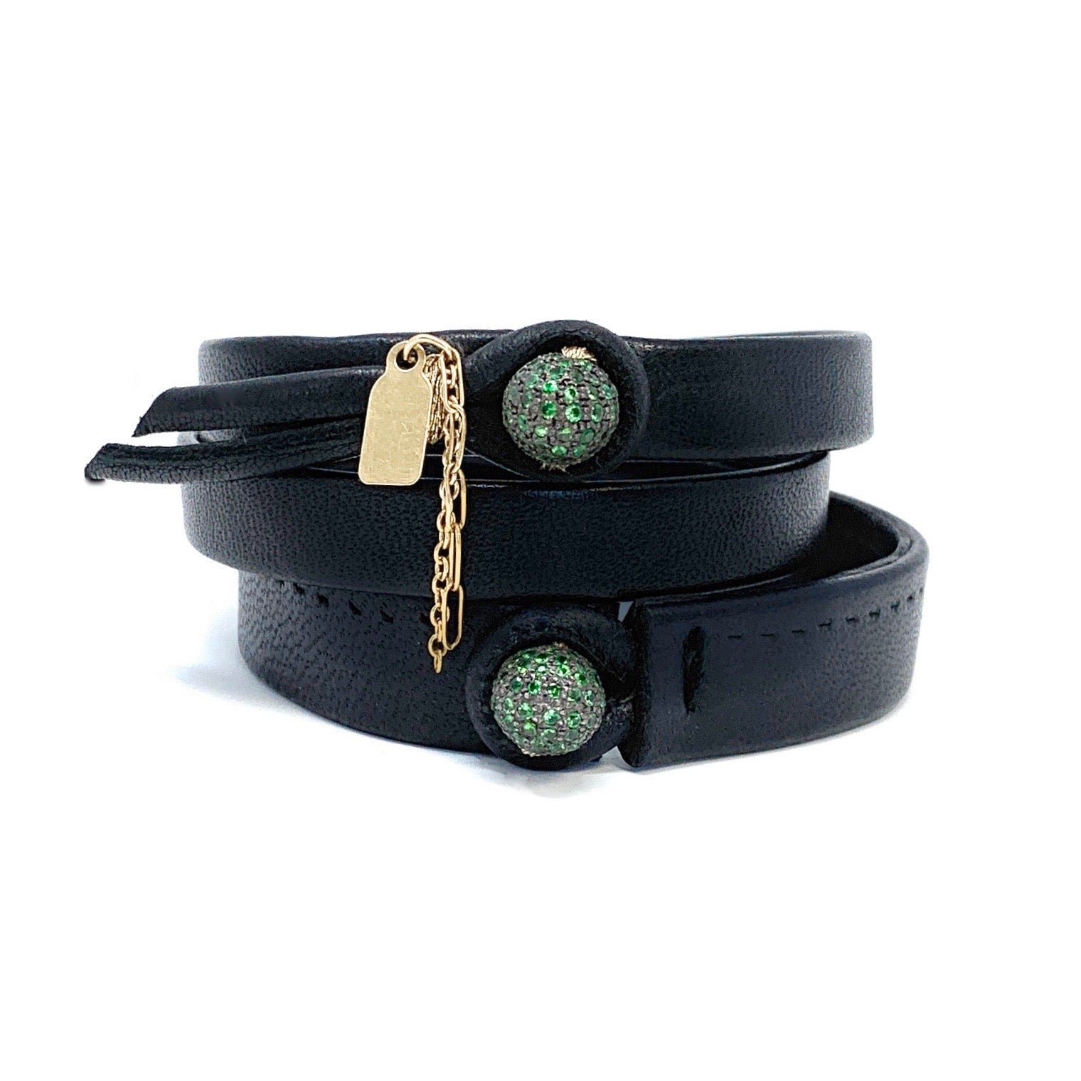 Close-up of tsavorite ball on The Verdante single wrap leather bracelet


